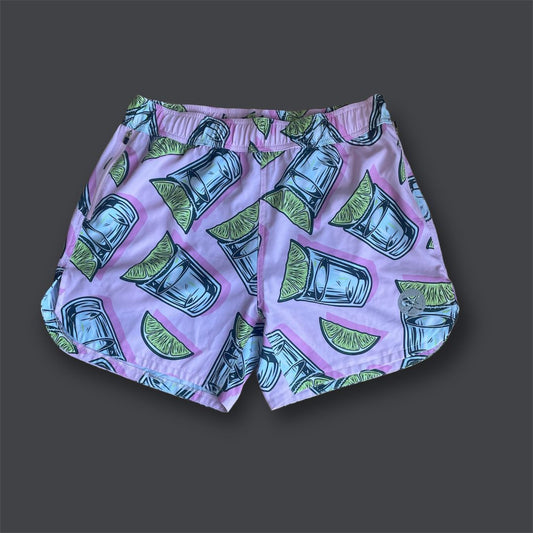 pink running shorts with glass and lemon/lime pattern